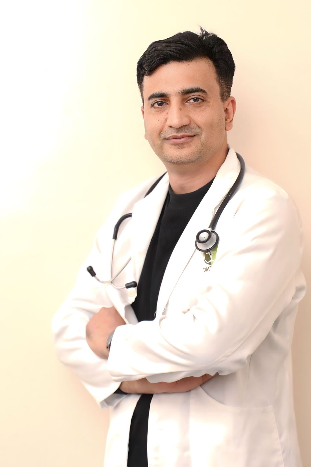 Professional portrait of a primary care physician at Caroline Health Care.