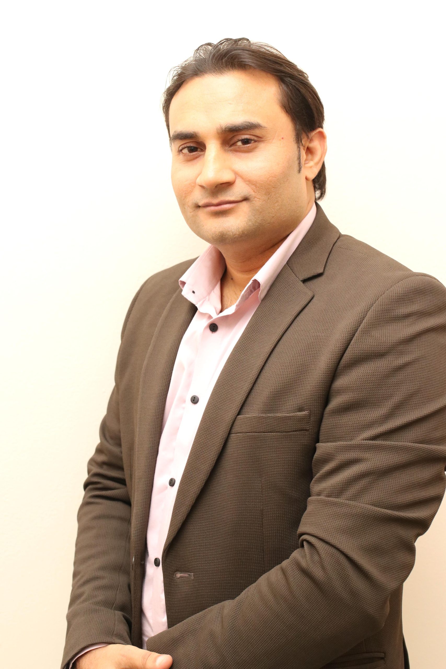 Professional portrait of a healthcare operations and planning team member at Caroline Health Care.